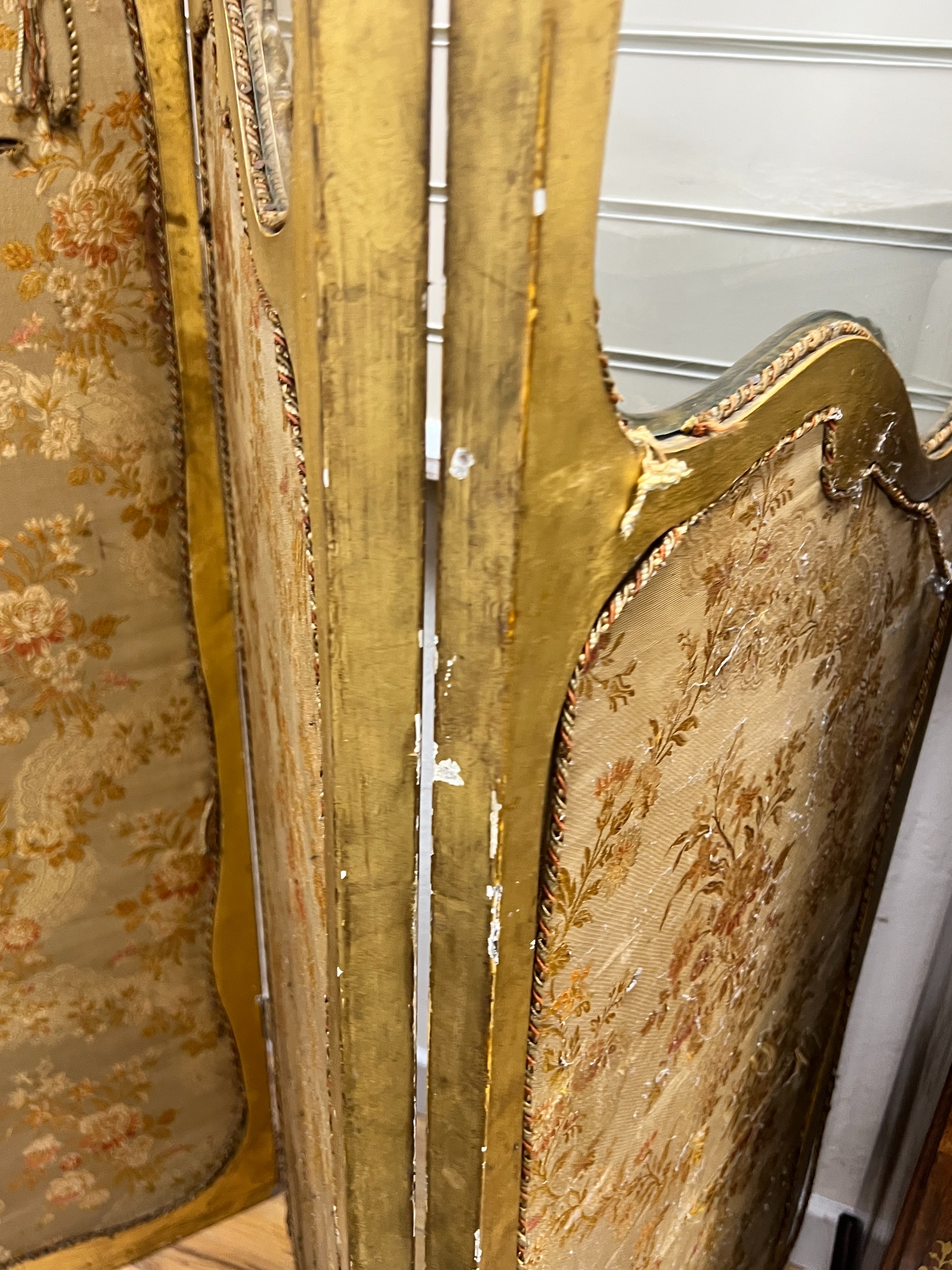 A Louis XV style carved glazed giltwood three fold dressing screen, height 185cm